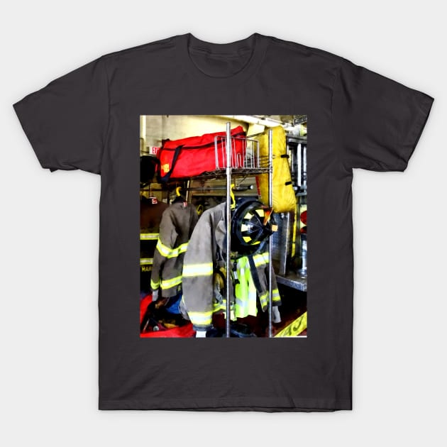 Firemen - Uniforms Inside Firehouse T-Shirt by SusanSavad